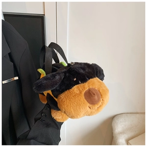 Close-up of a fluffy plush puppy handbag with a durable black strap and secure zipper