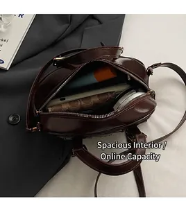 Interior view showing the spacious capacity of this retro brown Boston shoulder bag