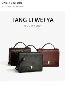 Detailed view of the textured leather texture and golden metal hardware on crossbody bags