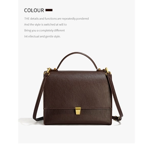 Detail of dark brown leather texture and elegant gold buckle on women's vintage bag