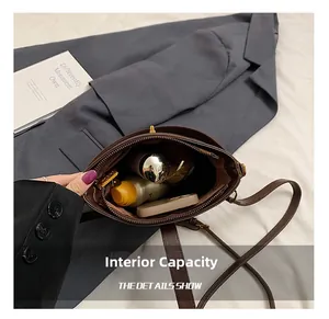 Detail view of the brown leather bucket bag internal capacity and storage space