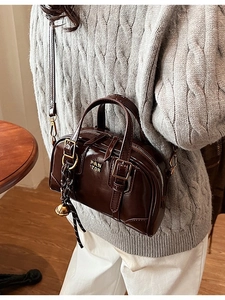 Retro brown glossy Boston bag with top handles and adjustable strap for women