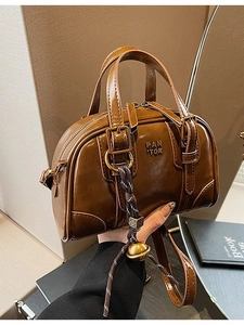 Retro brown oil-wax leather Boston bag with dual handles and golden sphere charm detail