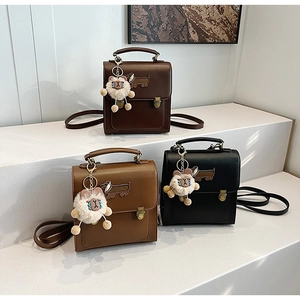 Detailed view of vintage-style leather backpacks in dark brown, caramel, and black colors