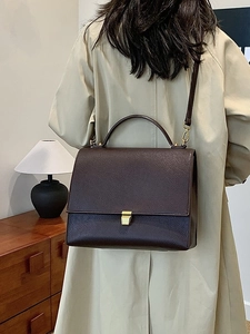Classic dark brown pebble leather crossbody bag with elegant gold metal square clasp