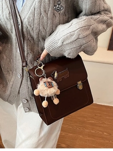 Vintage brown leather square backpack with dachshund embroidery and plush charm