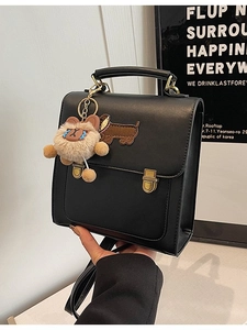 Vintage black square backpack with dachshund patch and plush bear charm decoration