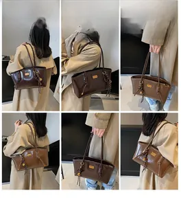 Detailed views of vintage large capacity PU leather shoulder bag on a model