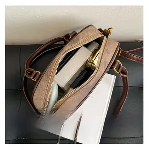 Internal capacity view of leopard print crossbody bag showing space for cosmetics and essentials