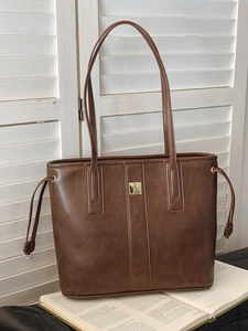 Vintage dark brown tote bag in textured faux leather with gold buckle for commuting