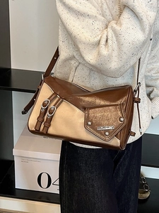 Retro patchwork brown and beige underarm bag with adjustable strap in 45-degree view