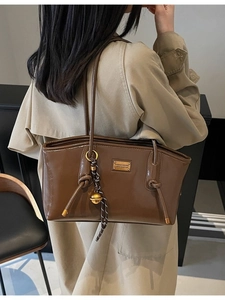 Retro coffee brown faux leather tote bag with gold brand plate and rope charm