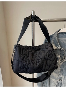 Black floral quilted canvas crossbody bag with adjustable wide shoulder strap for women