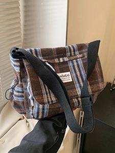 Retro plaid crossbody bag with brown check pattern and adjustable black shoulder strap