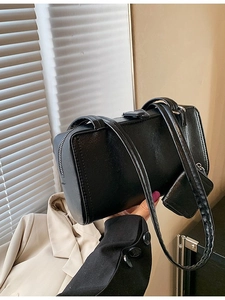 Minimalist black faux leather shoulder bag with matching mini coin purse and metal zipper