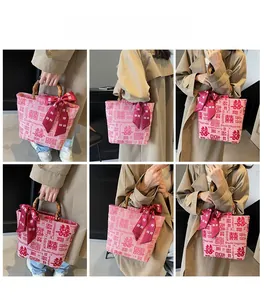 Multiple views of a pink canvas wedding tote bag with bamboo handles and bow details