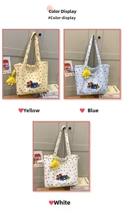 Three color options of polka dot canvas tote bags with cute puppy embroidery and charms