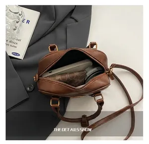 Interior view of brown leather handbag showing large capacity for daily items