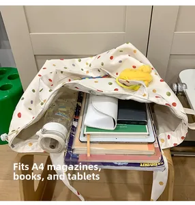 Spacious tote bag interior showing capacity for A4 magazines, books, and tablets