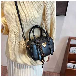 Modern black PU leather crossbody bag with golden triangle decor and rope detail