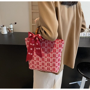Detail of red wedding tote bag with bamboo handles and double happiness jacquard
