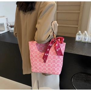 Pink woven tote bag with Chinese Xi character pattern and vintage bamboo handle detail