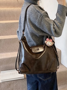 Vintage dark brown faux leather shoulder bag with adjustable strap and cute bear charm