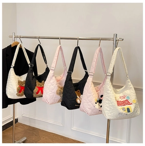 Quilted nylon tote bags in white, black and pink with cute plush bear charms on hangers