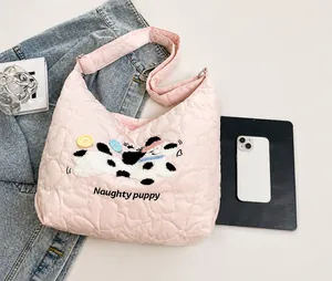 Pink quilted heart nylon tote bag detail with cartoon dog patch and size comparison