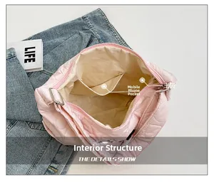 Internal view showing phone pocket and spacious main compartment of pink quilted tote bag
