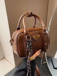 Retro dark brown mini Boston handbag with dual handles and metal logo detail