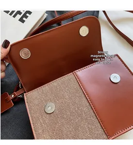 Détail montrant les boutons magnétiques et les coutures d'un sac patchwork marron