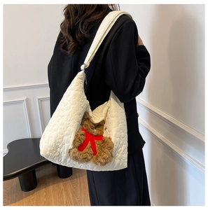 Quilted nylon tote bag in off-white featuring a cute brown plush bear charm for daily commute
