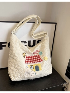 Quilted cream nylon tote bag with cute embroidery and adjustable shoulder strap