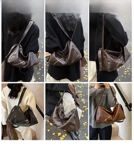 Multi-angle views of large vintage tote bag with decorative zippers and moon shape