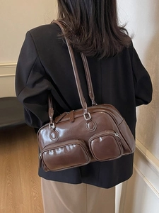 Fashionable dark brown leather bowling bag with large capacity and long shoulder straps