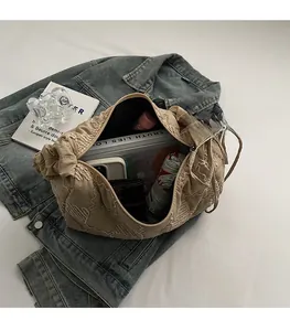 Detailed interior of the beige quilted tote bag showing large capacity for daily items