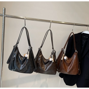 Three large soft leather tote bags in black, coffee, and brown with baseball charms