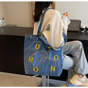 Blue denim tote bag with yellow embroidery D T M O O N, ideal for casual daily commuting