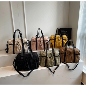 Matrix display of nylon tote bags in beige, pink, yellow, black, green, and coffee