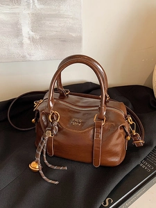Retro dark brown Boston handbag in glossy PU leather with adjustable strap and charm