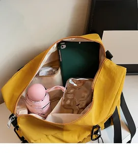 Interior view of yellow nylon bucket bag showing large capacity for tablet and daily items
