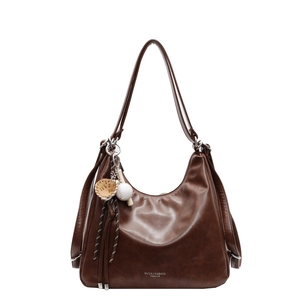 Brown vintage hobo tote bag in oily leather finish with a baseball-themed charm