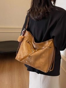 Brown vintage large capacity crossbody tote bag with plush ball charm for daily commute