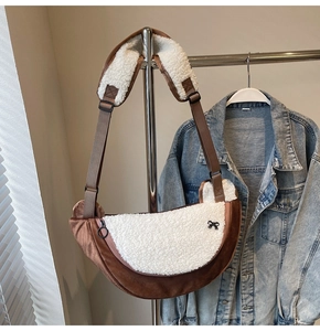 Detail of crescent crossbody bag with brown velvet and white faux shearling patchwork