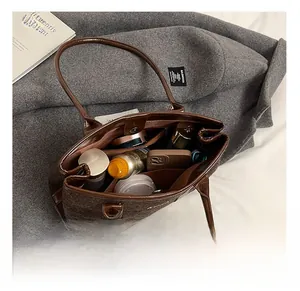 Detail showing the spacious interior compartments of this vintage brown wool tote bag