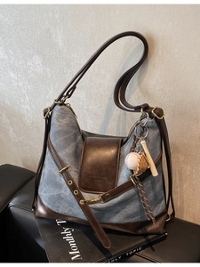 Retro denim and brown leather patchwork tote bag with baseball charm and shoulder strap