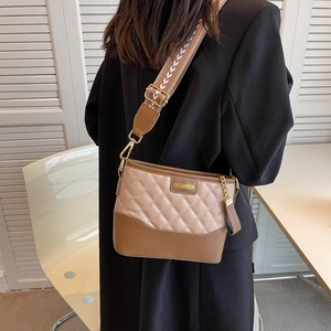 Quilted diamond lattice detail on beige and brown leather crossbody bag for women