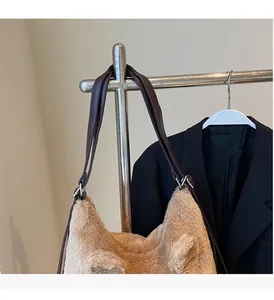 Detail of plush camel tote bag with 3D animal ears and durable leather shoulder straps