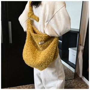 Ginger wool tote bag featuring a knotted shoulder strap and plush texture for women